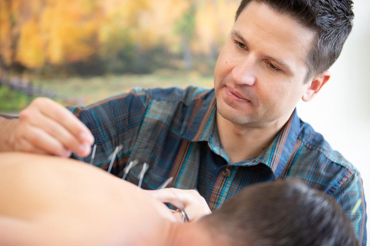 Acupuncturist performing treatment in Denver Colorado clinic