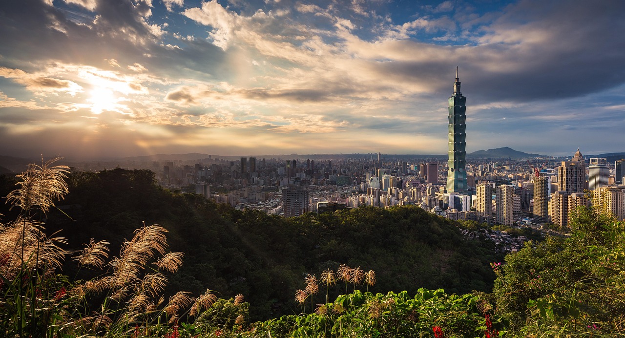 Taipei skyline with Taipei 101 tower piercing morning clouds